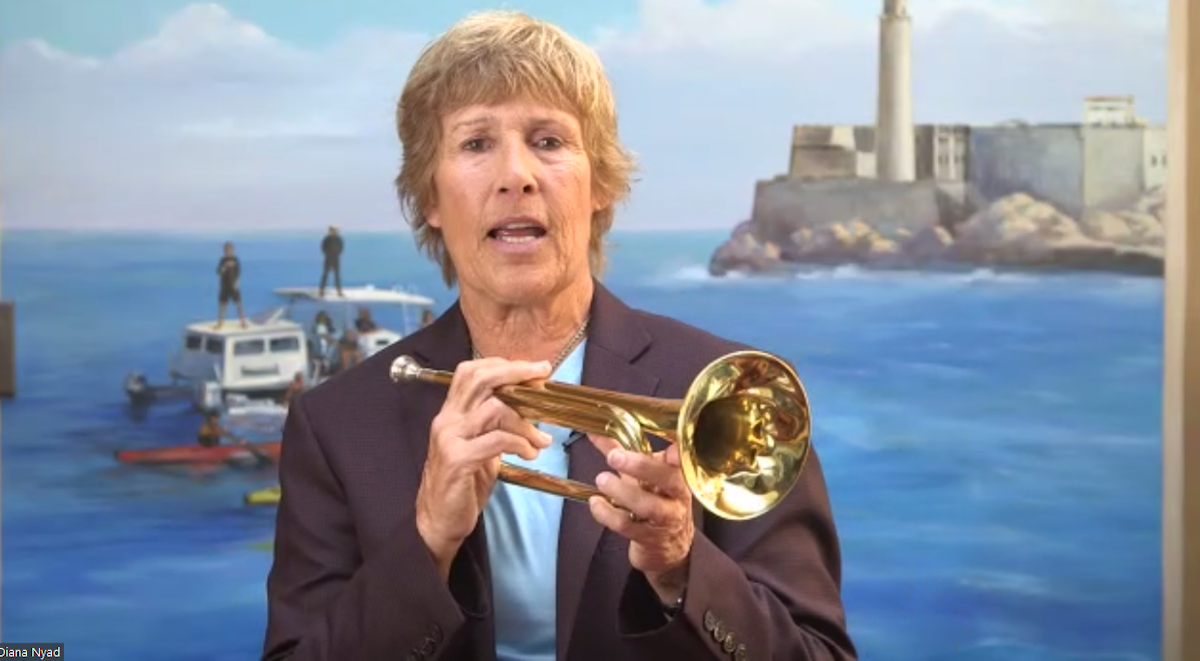 Diana Nyad with a trumpet.